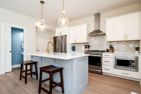 Cook, chat, and gather – modern kitchen meets family moments.