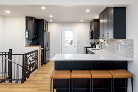 Brand new fully stocked kitchen with seating and tons of counter space 