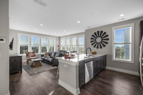 Fully equipped kitchen stocked with your basic cooking essentials, stainless steel appliances, and breakfast bar seating.