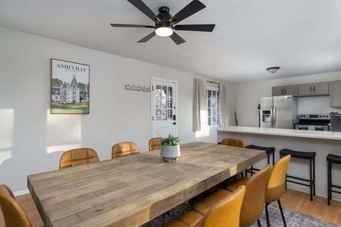Dining table for 8 and 3 additional barstools in the kitchen
