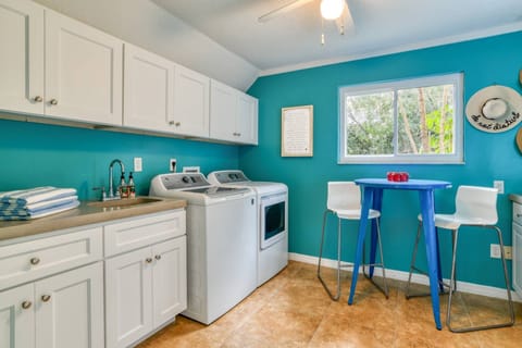 The laundry room has plenty of space to clean those clothes mid-week.