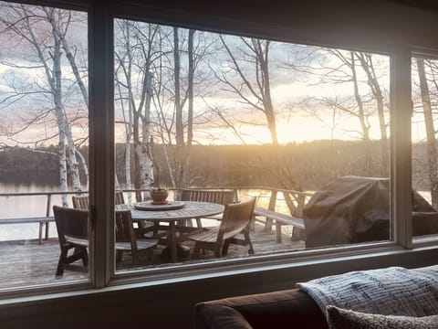 Winter view from the living space of the deck and pond.