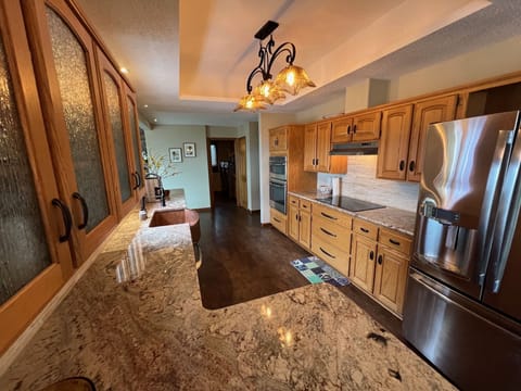custom kitchen with granite countertops and copper sink!