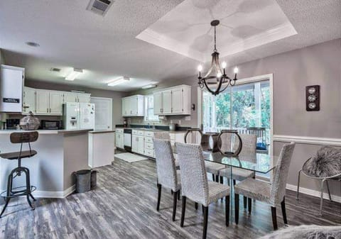 Open concept well-equipped kitchen & laundry room