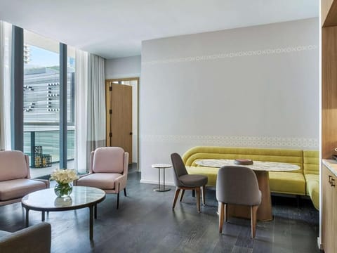 Gather for coffee in the airy lounge beside floor-to-ceiling windows.