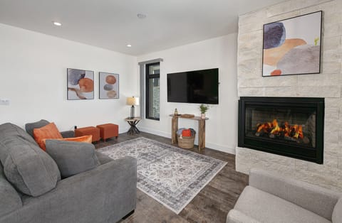 Living area with smart TV and gas fireplace.