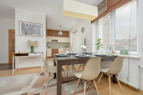 Another perspective of the dining area, showcasing the harmonious blend of modern and rustic design elements.

