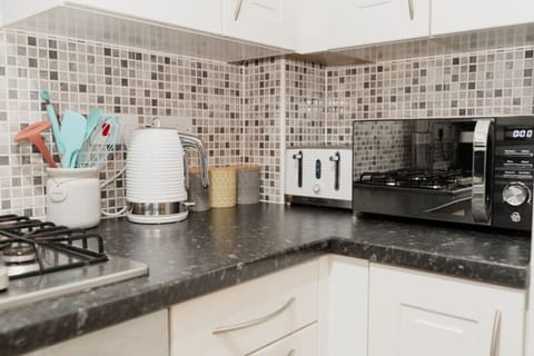 Essential Appliances Provided: Enjoy the Convenience of a Kettle, Toaster, and Microwave