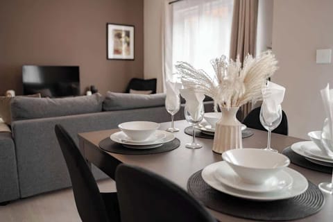 The Living/Dining Room: with easy flow between living spaces, the living room's dining table is perfect for hosting memorable evenings with friends and family.