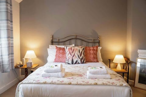 Bedroom 1: drift into peaceful sleep in the king size bed in our master bedroom.