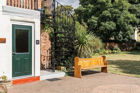 The Entrance: the property is found on the second floor, accessible through the spiral staircase. Please note that these steps are steep and not suitable for anyone with mobility issues.