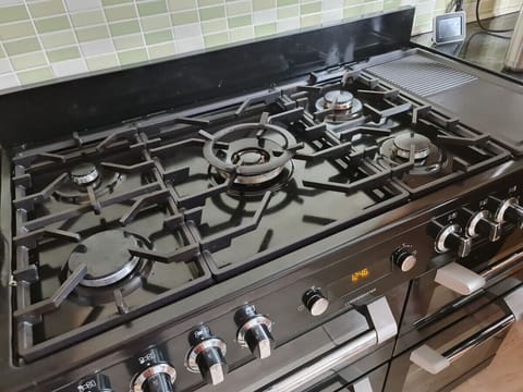 The Kitchen: with a new 5-ring stove, hosting dinner parties and preparing meals for large groups is a breeze.