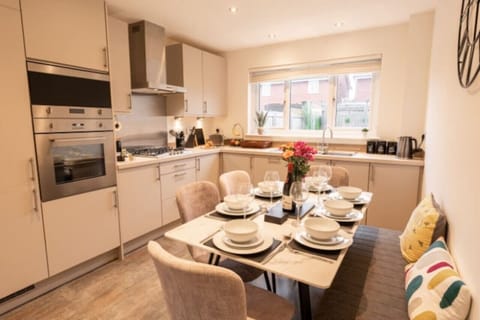 The Kitchen/Dining Space: whip up your favourite meals in the beautifully presented kitchen, equipped with modern amenities and a comfortable dining table and seats.