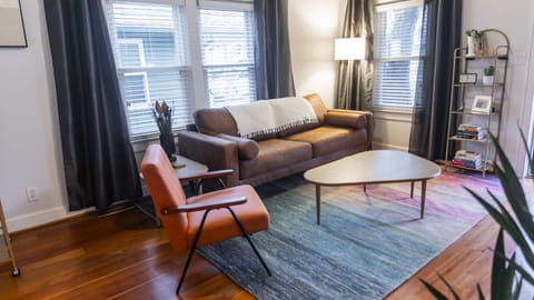 Living room. Vegan leather couch and accent chair.