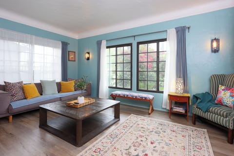 Unwind in this bright and colorful living space featuring cozy seating.
