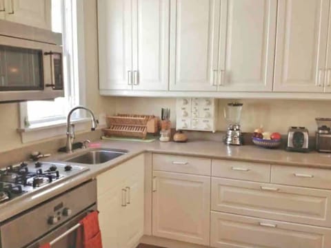Renovated kitchen w/ newer stainless steel appliances & quality pots &pans