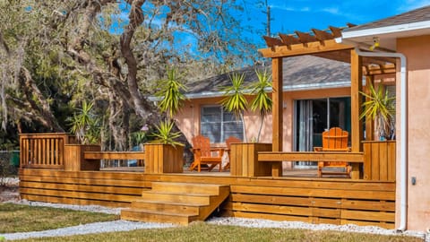 Enjoy the custom deck built around a beautiful live oak tree!