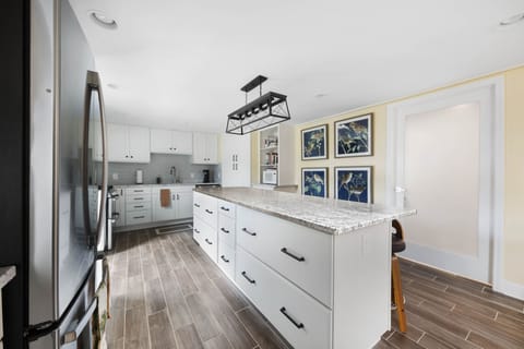 The eight-foot island is a great place to engage with activities of the kitchen