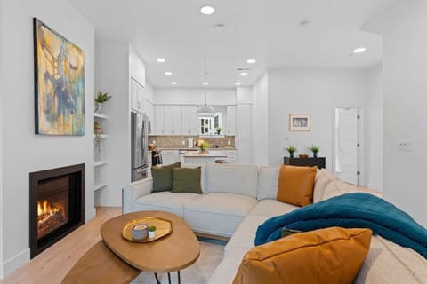 Impeccably designed living room.. Plush, luxurious couches, pillows and throw. .