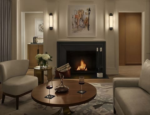 Gather by the fireplace with wine for a relaxing night.