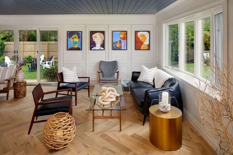 Sip coffee beside garden views in this airy sitting room.
