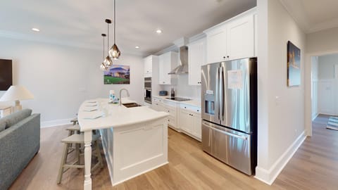 A stylish dining area adjacent to the kitchen — enjoy meals together in comfort and style.