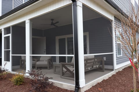 Private screened-in porch—perfect for morning coffee, evening breezes, and relaxing outdoors without the bugs.