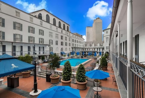 Soak up sunshine poolside in a serene courtyard oasis.