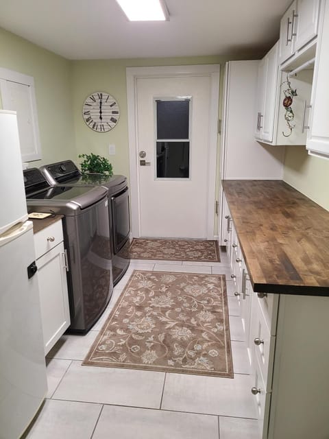 10X21 LNDRY RM WITH W/D, IRON/IRONING BD, HAMPER CART W/WHEELS, LOTS OF STORAGE 