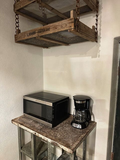 Fuel your day with convenience and comfort. The microwave and coffee maker stand ready to kickstart your mornings and keep you energized throughout the day, ensuring every moment is filled with warmth and vitality