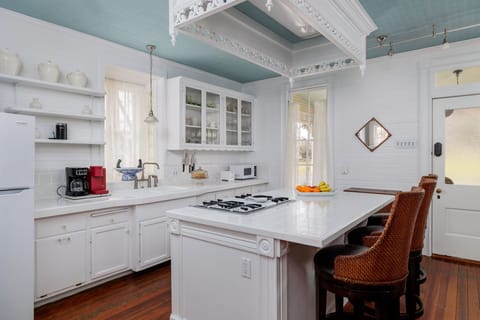 Entertain guests while preparing meals in the kitchen, where the island serves as a focal point for socializing and dining