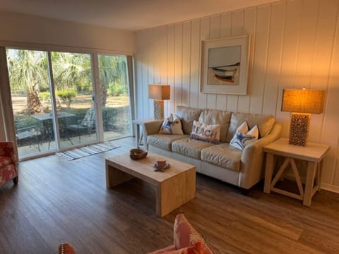 Living room overlooking 9th hole of Atlantic Dunes. Walk to the clubhouse!