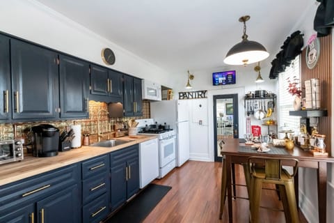 Eat-in fully equipped kitchen and pantry. Stocked coffee and tea bar. 