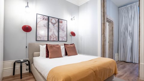 Drift off to sleep in this tastefully decorated bedroom, featuring captivating wall art and soothing colors. The comfortable bed and thoughtful design create a serene retreat after a day of adventures.