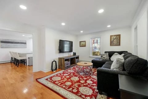 Cozy living room nestled between the oversized kitchen and four-season porch.