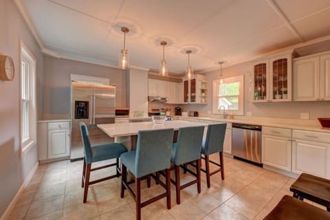 Well-appointed kitchen with an oversized island that seats four people.