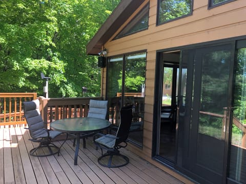 Outdoor dining on deck overlooking Lake Alice.