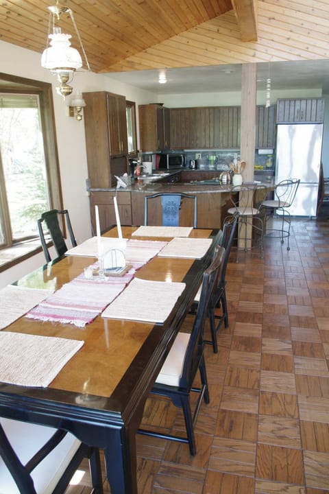Expanded dining table and kitchen.