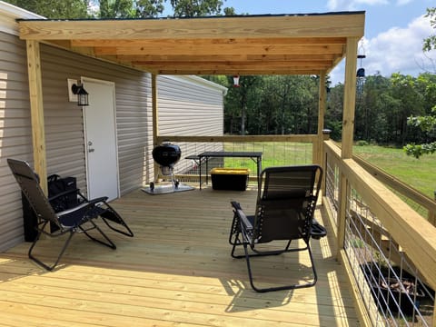 Covered end side deck, zero gravity chairs, grill and accessories, games.