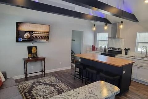 The open concept kitchen and living are at Pine Tree Corner Bungalow to relax and enjoy everything