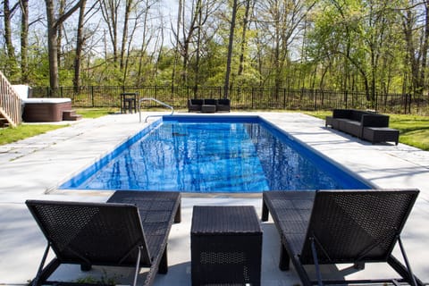 Enjoy a dip in the pool in the backyard