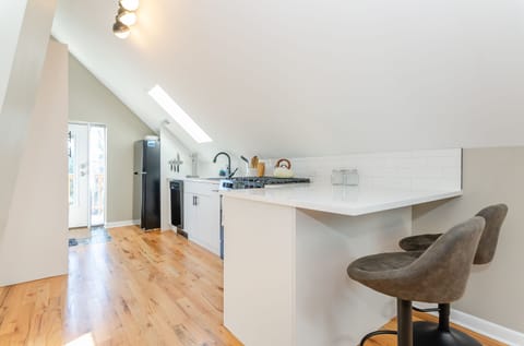 Open kitchen with counter seating for 2