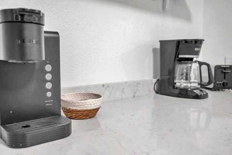Coffee station w/ drip machine and essentials ready for an easy morning brew