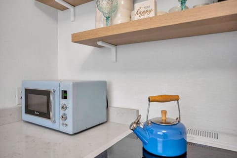 Compact kitchen essentials neatly set up for easy meals and quick snacks.