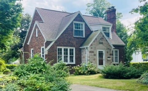 Brickstone Cottage.  Driveway has plenty of parking and empty grass lot on left.
