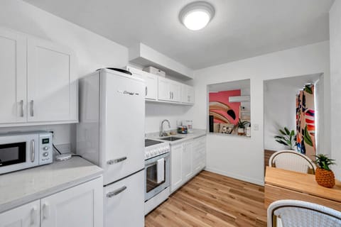 Clean, modern kitchen w/ sleek finishes & plenty of counter space for easy meals at home.