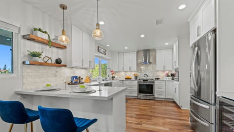 This modern kitchen with chic bar seating is a true showstopper.
