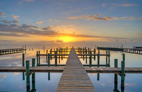 Take a walk along the dock at sunset.