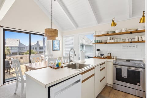 Kitchen and dining open to deck with views