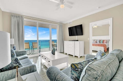 The living room offers a large seating area designed for comfort and gathering, with a spacious layout that feels open and inviting.